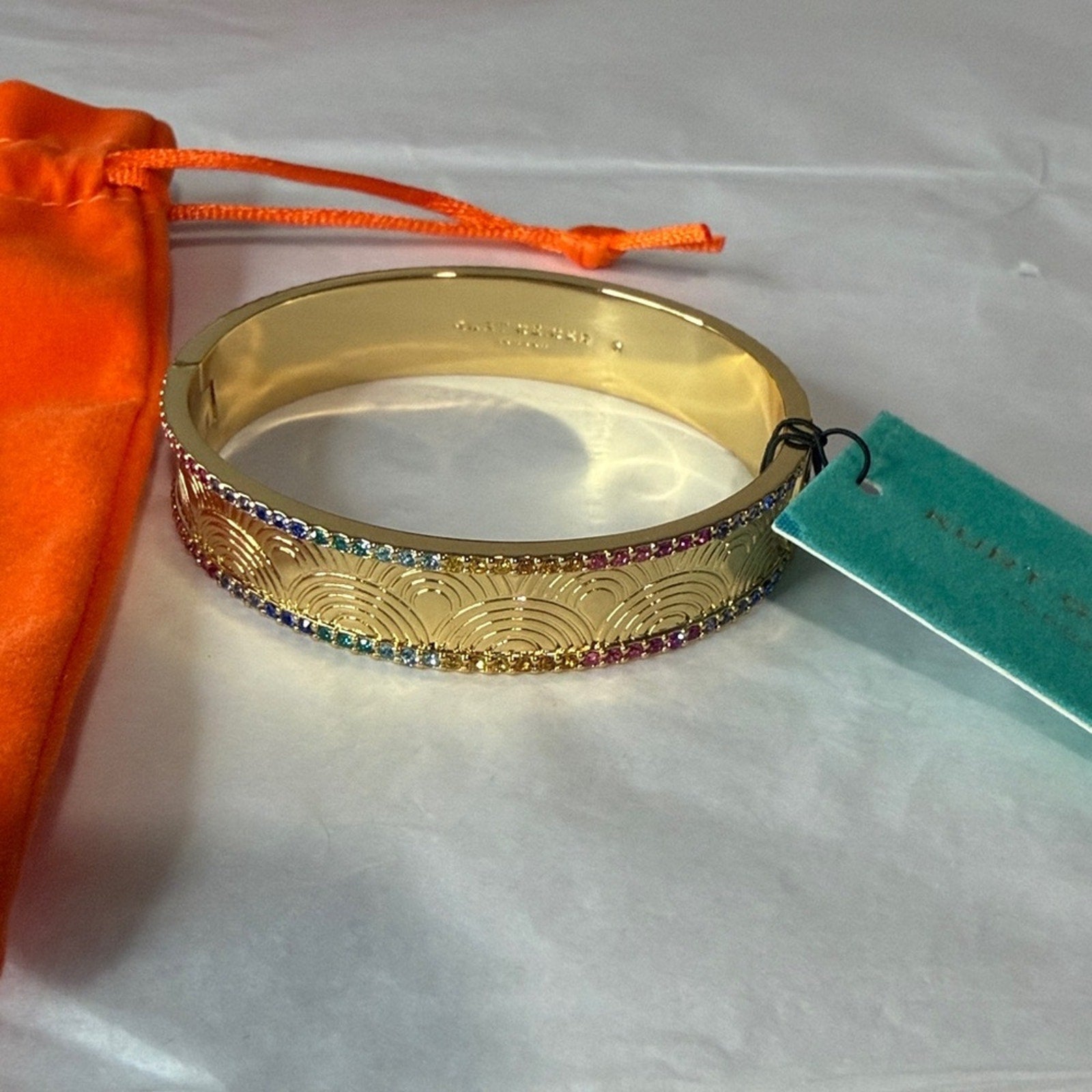 Kurt Geiger gold bangle with multi color
Stones