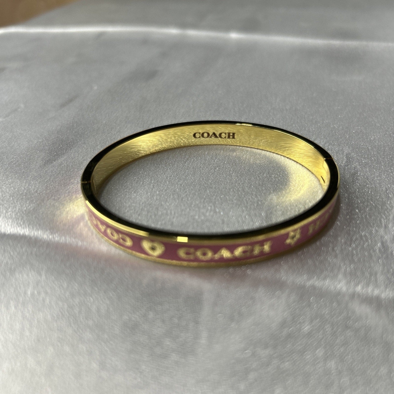 COACH PINK / GOLD HEART AND STAR ENAMEL BANGLE