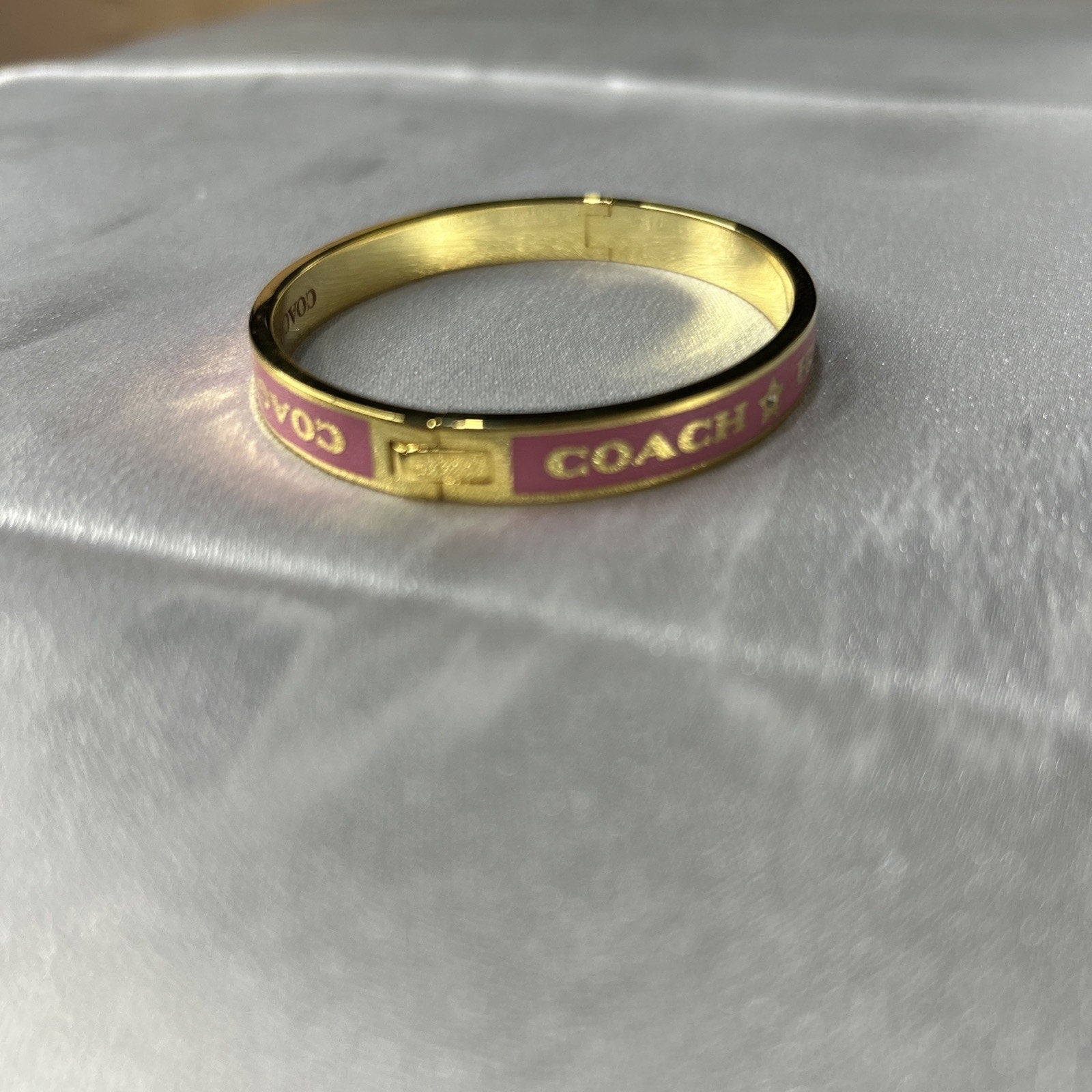COACH PINK / GOLD HEART AND STAR ENAMEL BANGLE