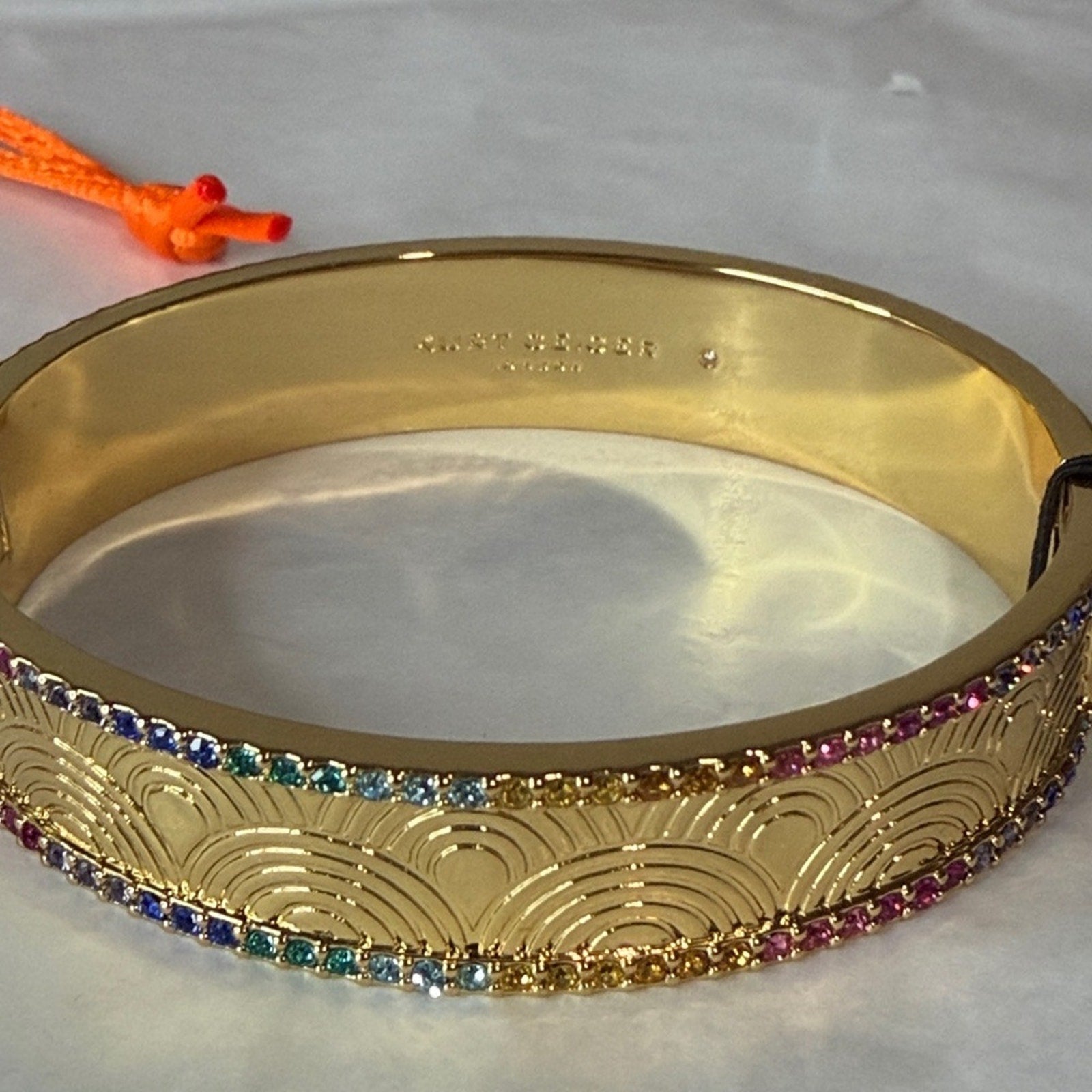 Kurt Geiger gold bangle with multi color
Stones