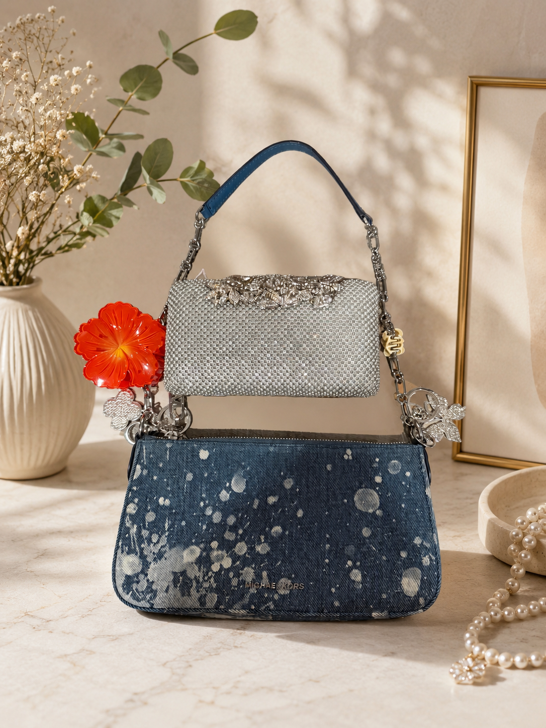 MK denim and silver clutch